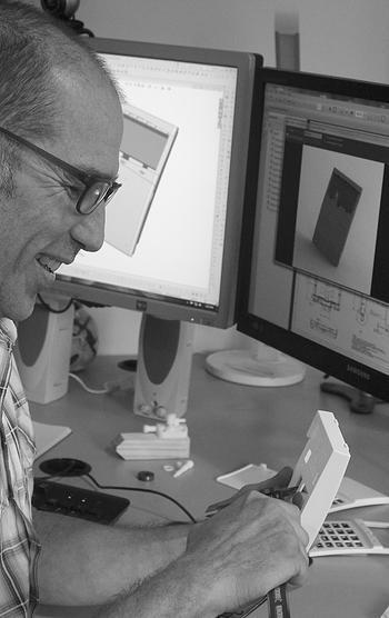Gary Bortz reviewing off tool samples of a design project